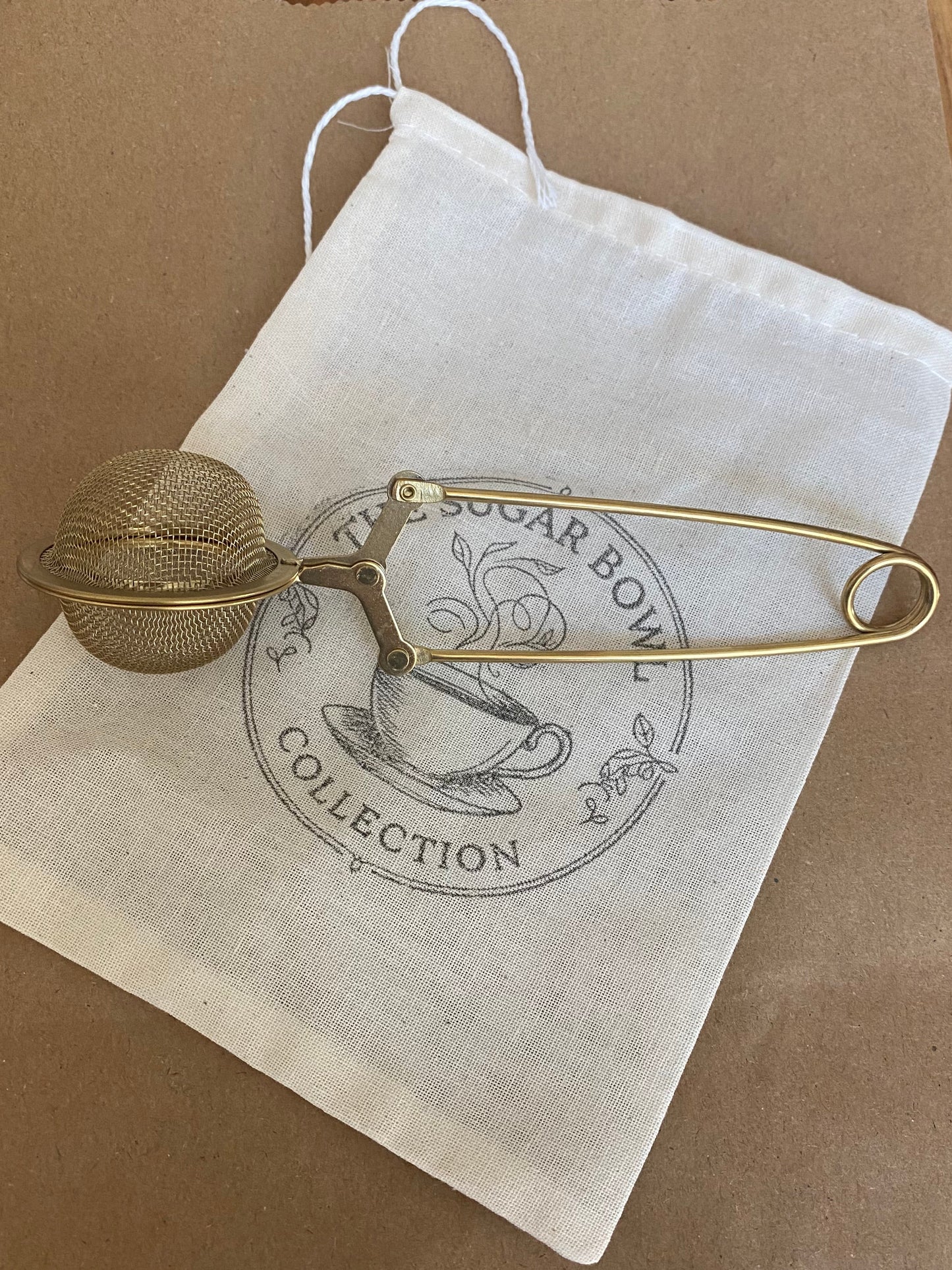 Gold tea ball infuser for brewing loose leaf tea
