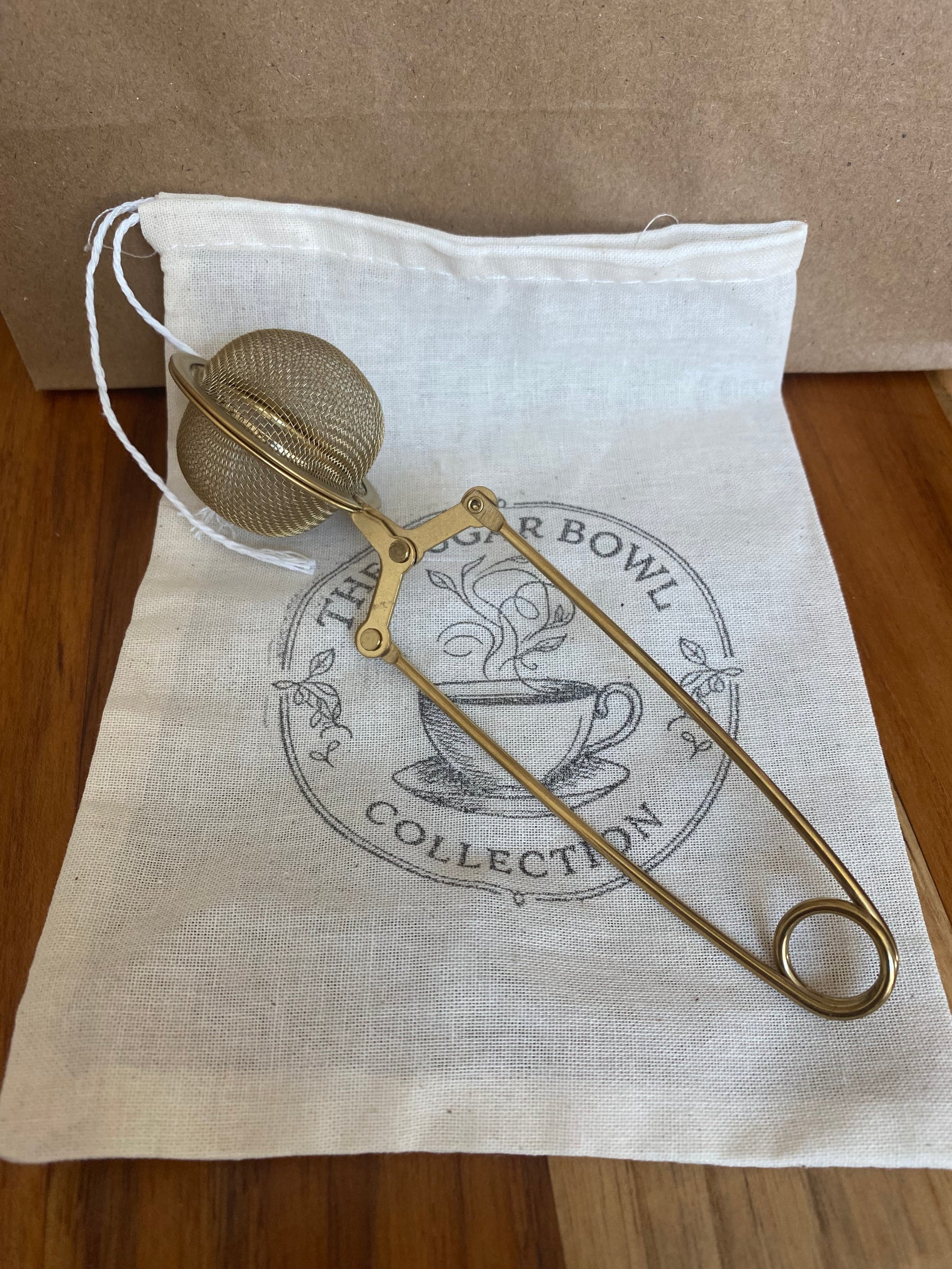 Gold tea ball infuser for brewing loose leaf tea