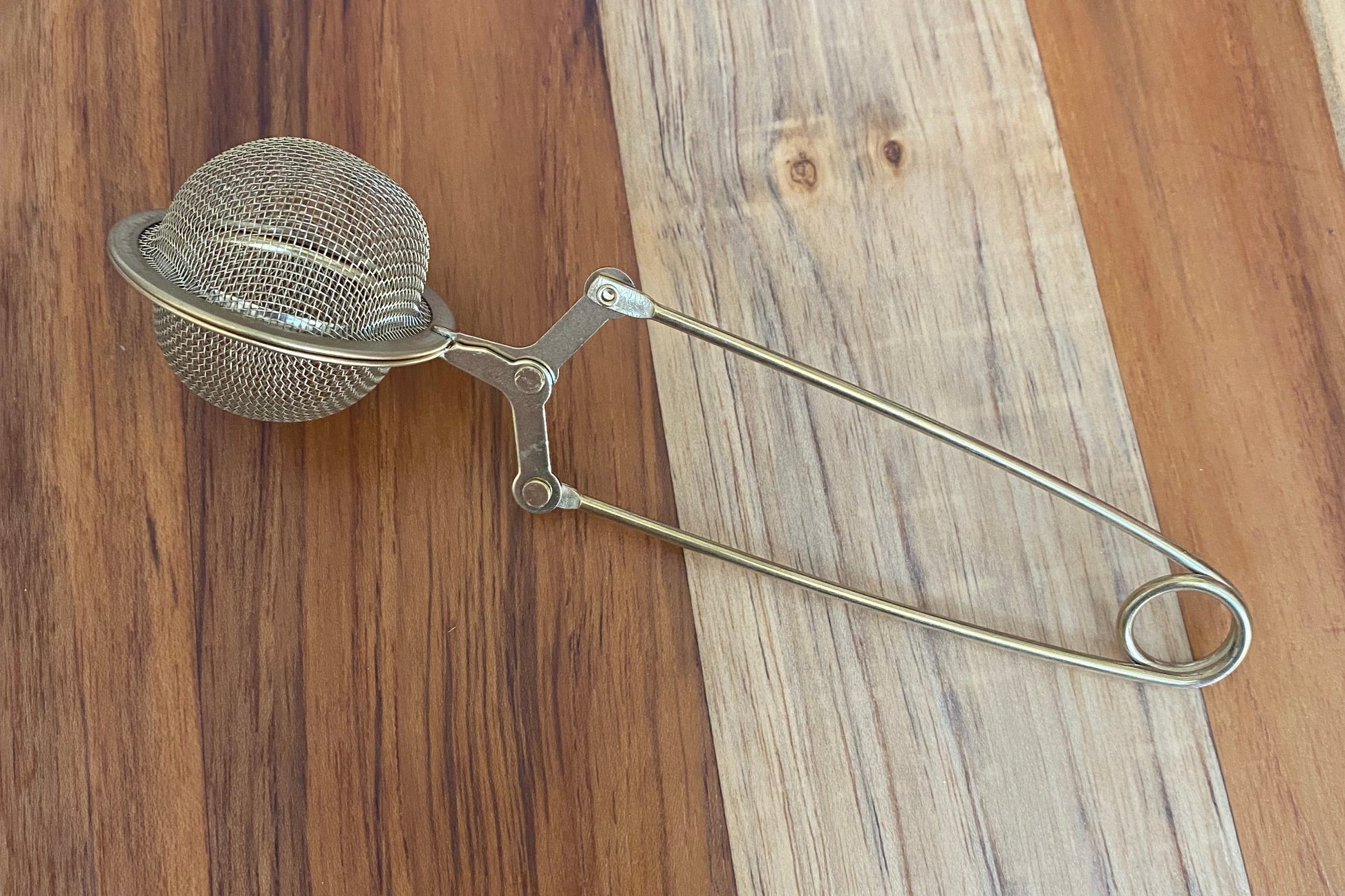 Gold tea ball infuser for brewing loose leaf tea